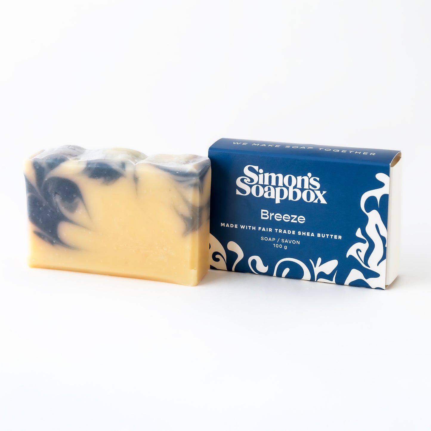 unwrapped bar of soap beside packaging