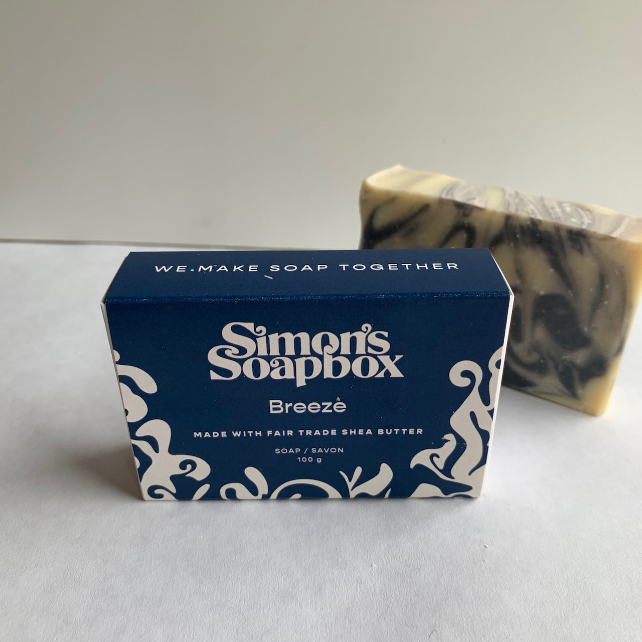 blue package of soap that reads we make soap together
