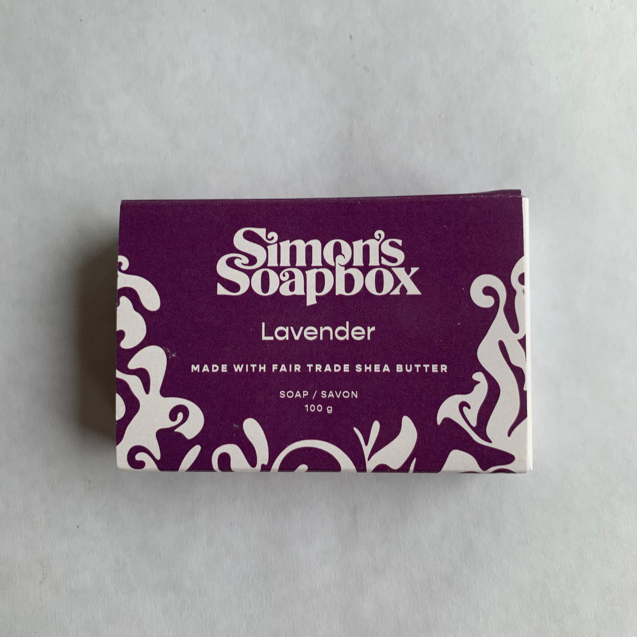 purple package that reads Simon's Soapbox Lavender made with fair trade shea butter soap/savon 100 g