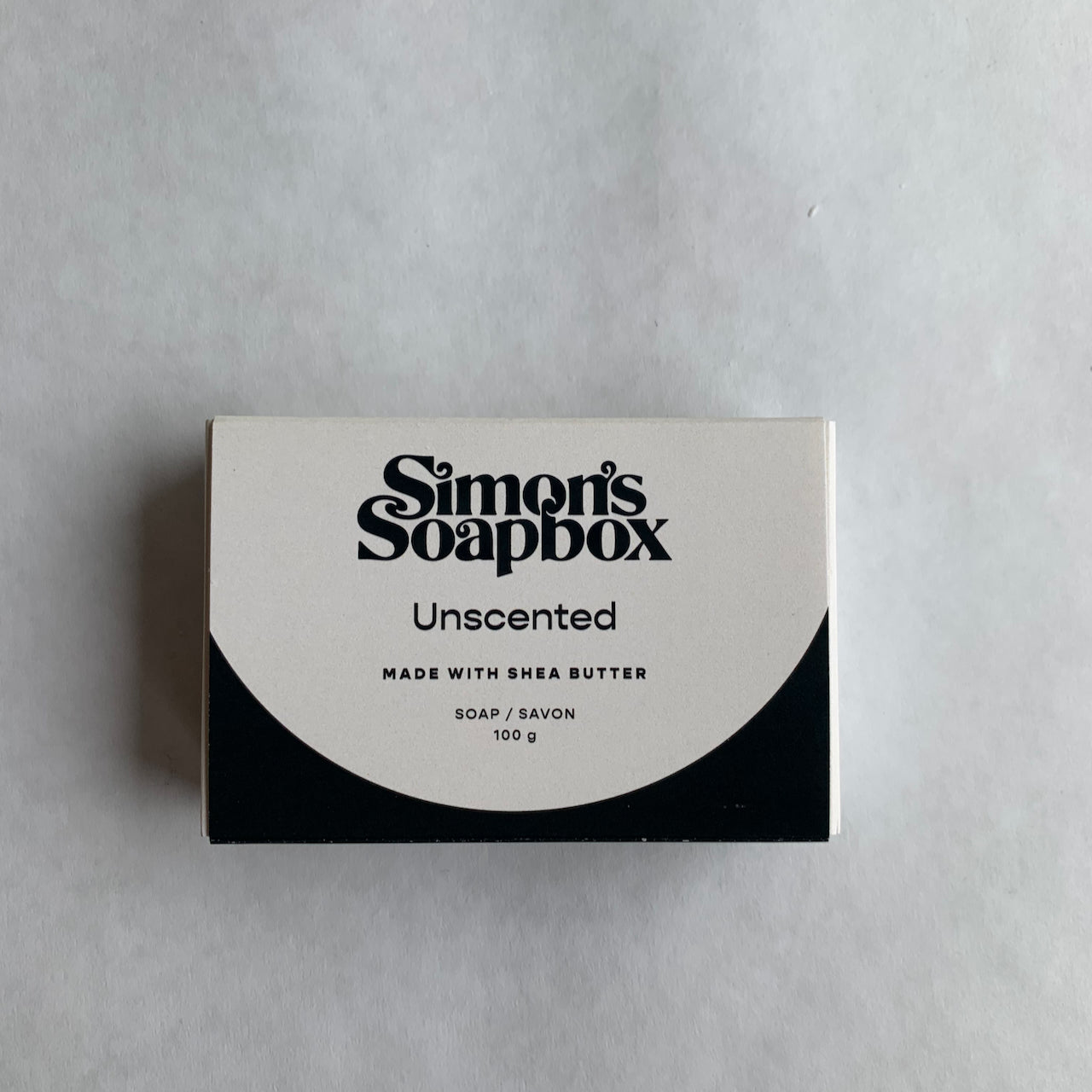 rectangle package, black and white with text Simon's Soapbox Unscented made with shea butter soap savon 100 g